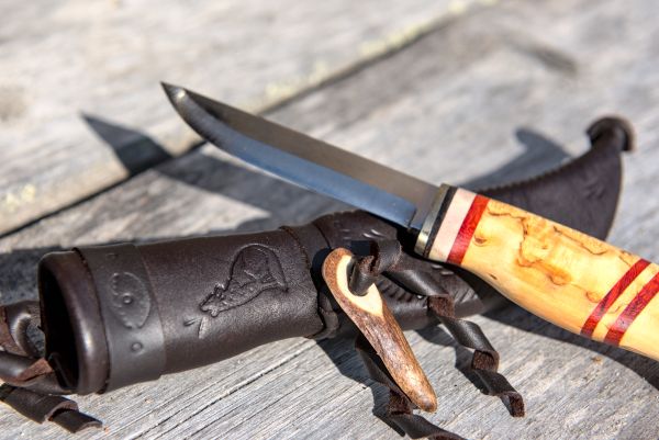 Knife with wooden handle and leather sheath