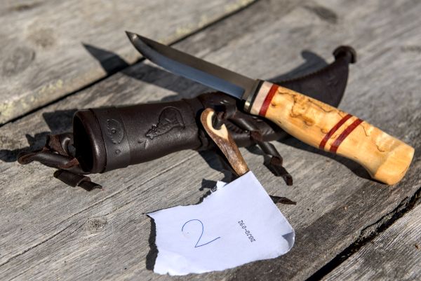 Knife with wooden handle and leather sheath