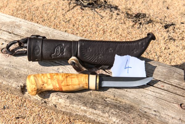 Knife with wooden handle and leather sheath