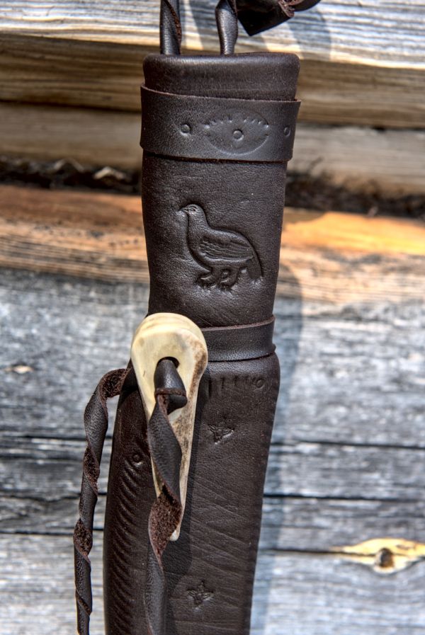 Knife with wooden handle and leather sheath
