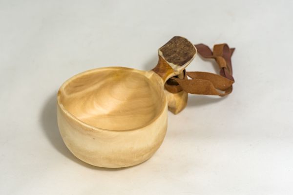 wooden cup with leather strap