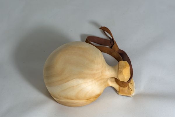 wooden cup with leather strap