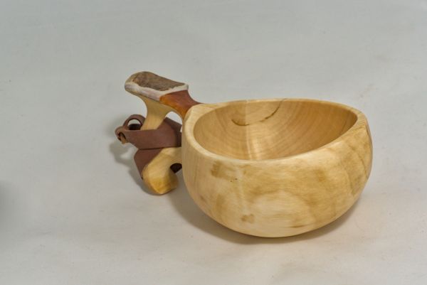 wooden cup with leather strap