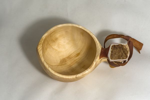 wooden cup with leather strap
