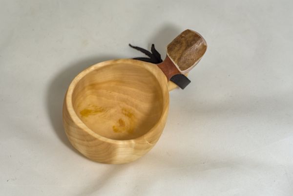 wooden cup with leather strap