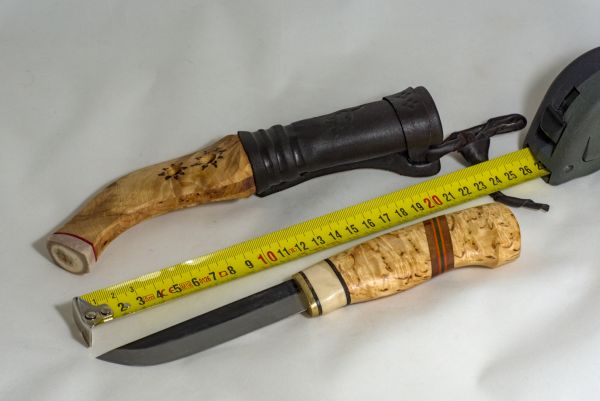 Knife with wooden handle and sheath made from wood and leather