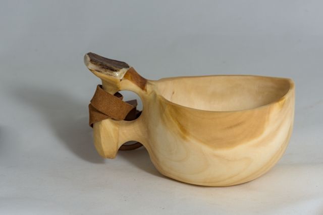 wooden cup with leather strap