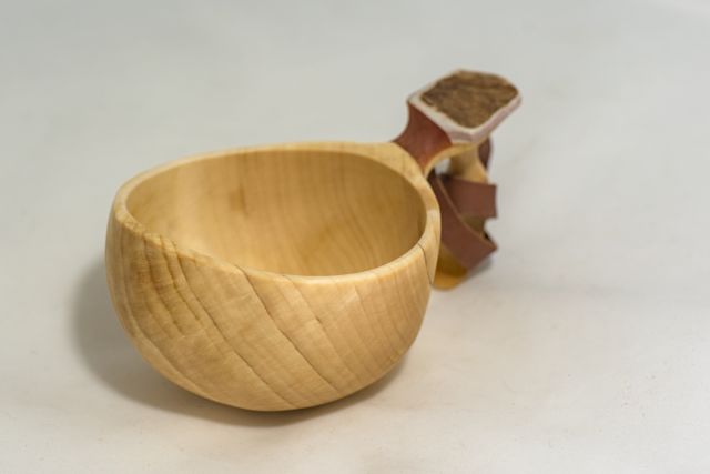 wooden cup with leather strap