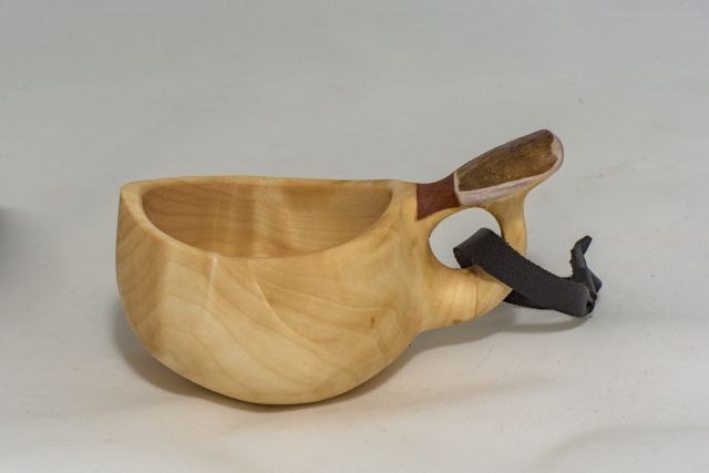 wooden cup with leather strap