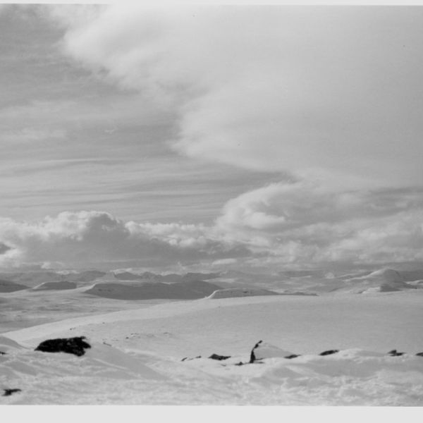 snow covered fell landscape with clouds