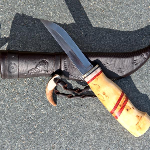 Knife with wooden handle and leather sheath