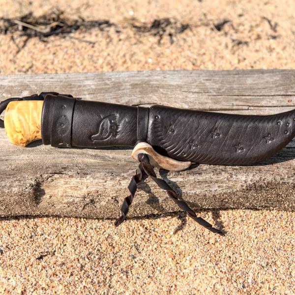 Knife with wooden handle and leather sheath