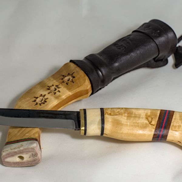 Knife with wooden handle and sheath made from wood and leather