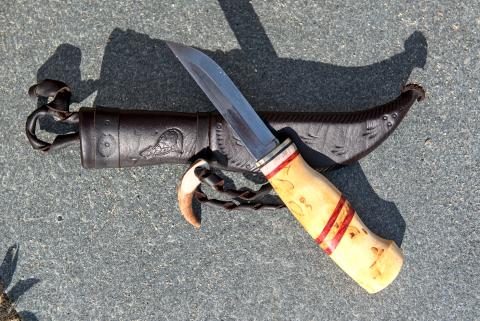 Knive with wooden handle and leather sheath
