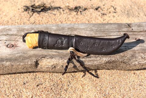 Knive with wooden handle and leather sheath